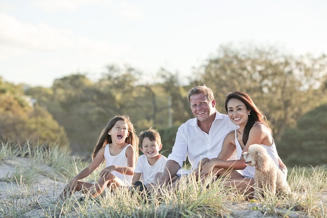 A family sitting in a field